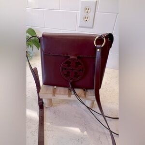 Tory Butch leather logo crossbody .  Color is a Cabernet.  Beautiful condition